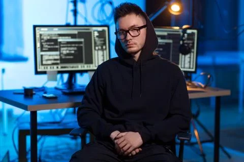 Asian hacker in dark room with computers at night 写真素材