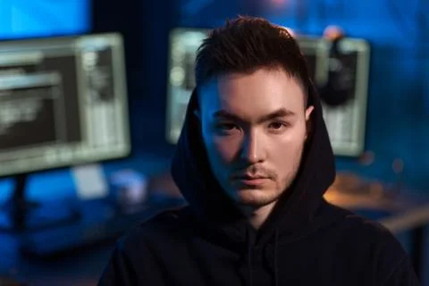 Asian hacker in dark room with computers at night Stock Photos