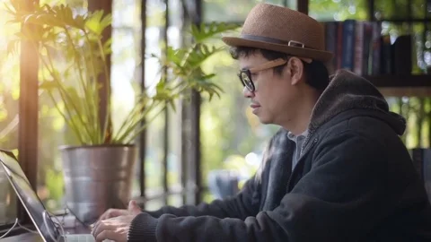 Asian Hacker using laptop and computers in cafe. Stock Footage 85042351