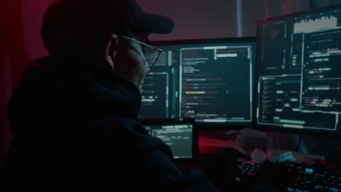 Asian hacker warming up arms and neck during cybercrime Stock Footage 257381871