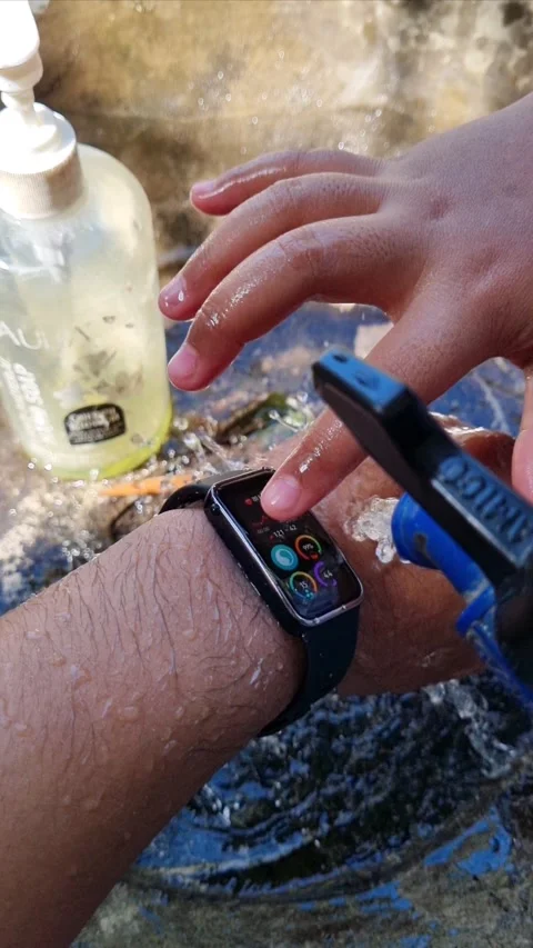 Asian hand with smartband waterproof Stock Footage 277497991