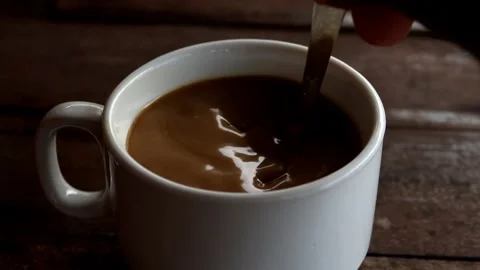 Asian hand stirring coffee Video stock 280956020