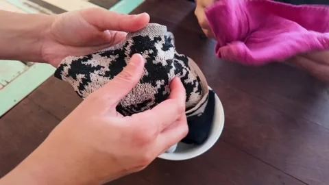 Asian Hands Folding and Preparing Cleaning Towels at a Restaurant Table Stock Footage 343363156
