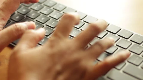 Asian hands randomly typing or clicking on portable wireless keyboard Stock Footage 221454895