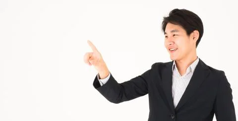 Asian handsome business man point for touch something. Crop for banner. Stock Photos