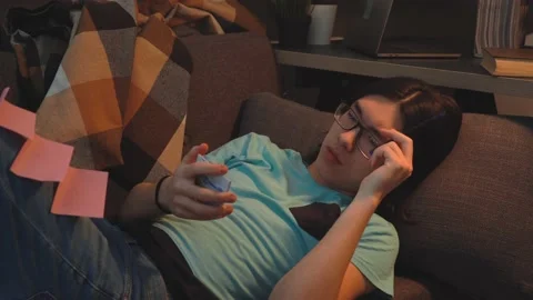 Asian Handsome  Guy is  Laying on the Sofa Thinking about Idea Stock Footage 148347601