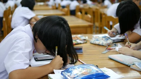 The Asian high school students in white uniform are studying in library,  Stock Footage 102429037