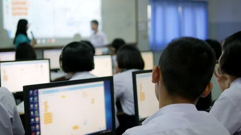 The Asian high school students in white uniform are studying computers Stock Footage 124014709