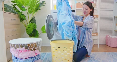 Asian housewife wash clothes Stock Footage 159963243