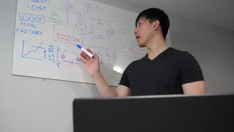Asian instructor teaching an electronics class Stock Footage 263858806