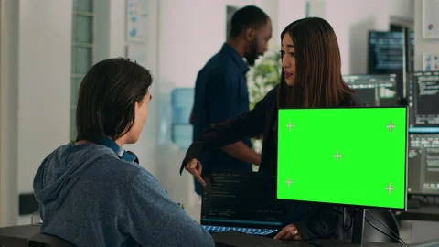 Asian IT engineers analyzing greenscreen on computer and coding database Stock Footage 217407774