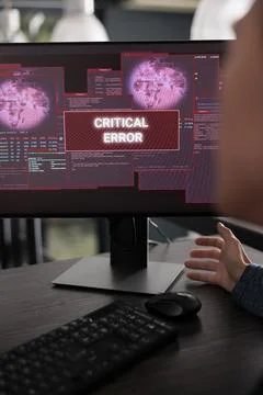Asian it programmer writing html code encountering hacking alert on computer Stock Photos
