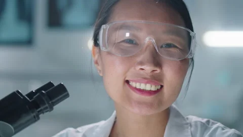 Asian Lab Worker Smiling At Camera Video stock 139683029
