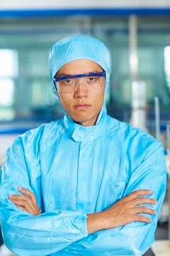 Asian Laboratory scientist working at lab with test tubes Stock Photos