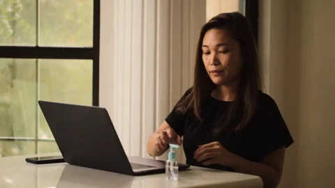 Asian lady browsing internet on the laptop work from home. Social distancing 스톡 동영상 128085752