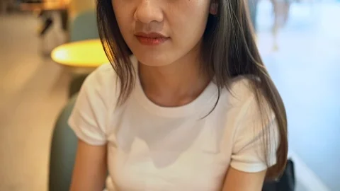 Asian lady drinking nitro cold brew coffee Stock Footage 126044758