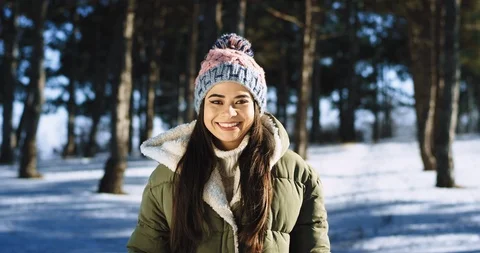 Asian lady in front of the camera smiling large and feeling excited in a hard Video stock 112614579