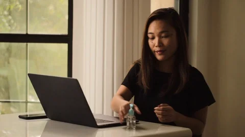 Asian lady working from home avoiding social distancing to fight coronavirus. 스톡 동영상 128086091