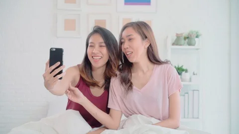 480px x 270px - Asian lesbian couple using phone VIDEO C... | Stock Video | Pond5