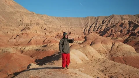 An Asian-looking guy walks and looks at the beauty of the area. Stock Footage 169910494