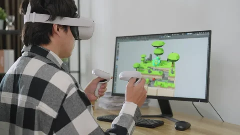 Asian male developer using computer to designer game at home. Stock Footage 203913929