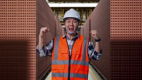 Asian Male Engineer Celebrating Working With Brick In Stacks Stock Footage 303759503
