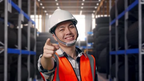 Asian Male Engineer Smiling And Touching His Chest Then Pointing Tire Warehouse Stock Footage 341786980