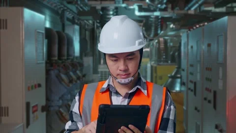 Asian Male Engineer Working On A Tablet In Engine Control Room Stock Footage 291864276