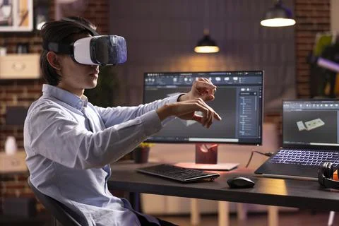 Asian male individual developing container model with ar technology Stock Photos