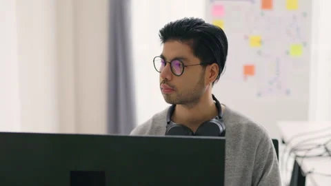 Asian Male Programmer Coding in Modern Office Environment. Stock Footage 310589314