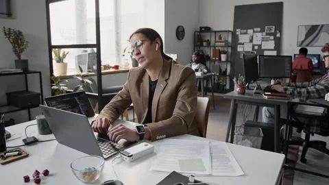 Asian Male Programmer Typing on Laptop and Closing Lid in Open-Plan Office Stock-Footage 336712119