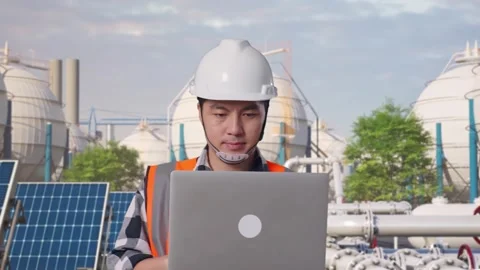 Asian Male Use Computer While Walking at Energy Complex Stock Footage 330174754
