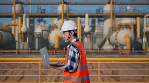Asian Male Use Computer While Walking at Energy Plant Stock Footage 331193047