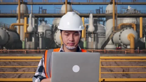 Asian Male Use Computer While Walking at Energy Plant Stock Footage 331193184