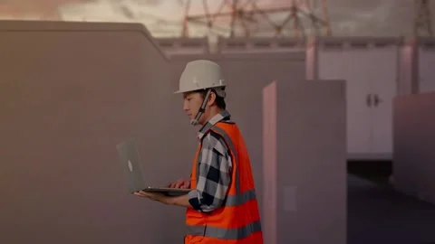 Asian Male Use Computer While Walking with Electrical Energy Stock Footage 331287630