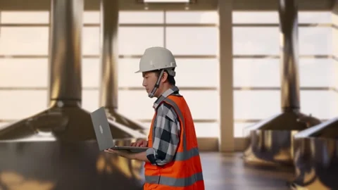 Asian Male Use Computer While Walking at Beer Plant Stock Footage 332158968