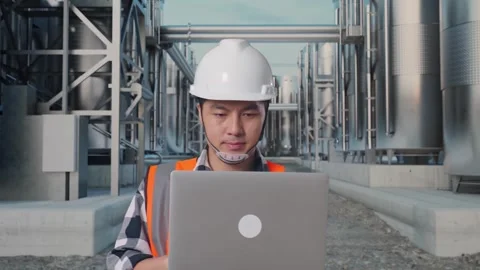 Asian Male Use Computer While Walking at Chemical Plant Stock Footage 332548402