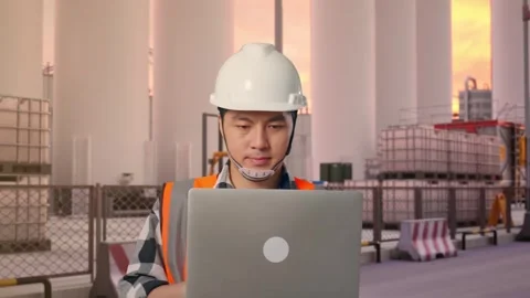 Asian Male Use Computer While Walking at Storage Facility Stock Footage 335073375
