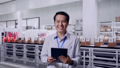 Asian Male Worker Smiling At The Camera at Coffee Factory Stock Footage 297860445