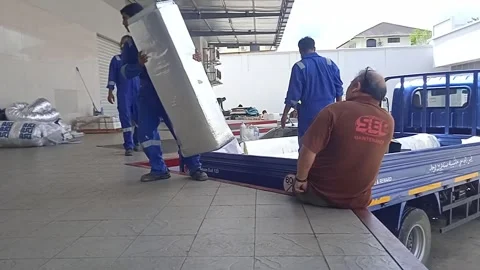 Asian Male Worker Unloading Materials From Delivery Truck Stock Footage 309306783