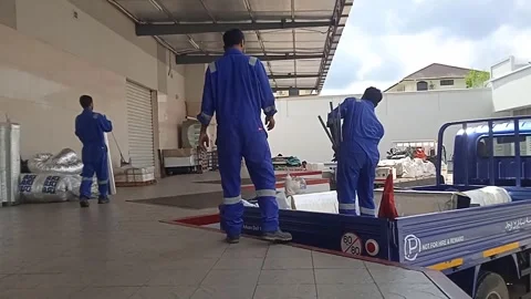 Asian Male Worker Unloading Materials From Delivery Truck Stock Footage 309306784