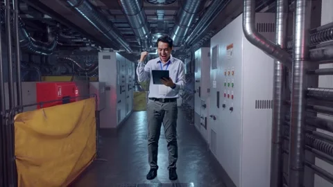 Asian Male Worker Use Tablet And Celebrating In Engine Control Room Stock Footage 292372938