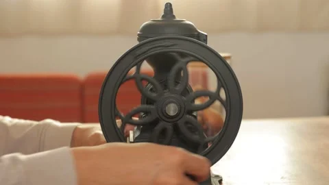 Asian male's hand spinning mill to grind coffee beans at home. No face. 25P. Stock Footage 224901641