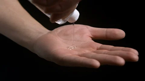 Asian man applying hand sanitiser 動画素材 129987730