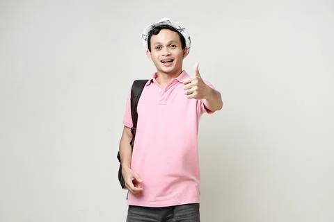 Asian man backpacker give thumb up gesture. digital nomad and travelling co.. Stock Photos