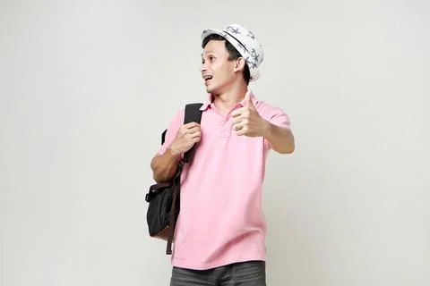 Asian man backpacker give thumb up gesture. digital nomad and travelling co.. Stock Photos