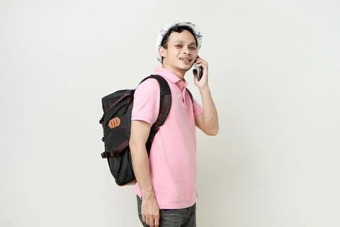 Asian man backpacker making a phone call. digital nomad and travelling conc.. Stock Photos