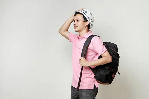Asian man backpacker portrait. digital nomad and travelling concept. on iso.. Stock Photos
