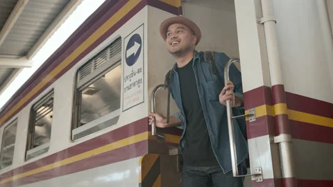 Asian man backpacker smiling when arrived at destination. Stock Footage 220874828