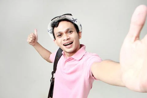 Asian man backpacker taking selfie photos. digital nomad and travelling con.. Stock Photos